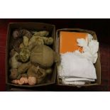 Two boxes of assorted lace, linen and childrens soft toys.