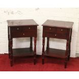 A pair of mahogany bedside cabinets raised on turned supports.