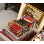 A collection of hardback books to include antique examples along with three gilt framed prints