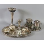 An oval silver plated gallery tray and other plated wares including specimen vases,