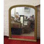 A large C19th gilt framed dome topped over mantle mirror.