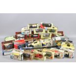 A collection of boxed diecast model cars, vans and buses to include Corgi,