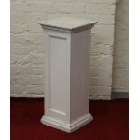 A painted square formed pedestal jardiniere stand.