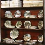 A large collection of Bradford Exchange cabinet plates in original boxes with certificates to