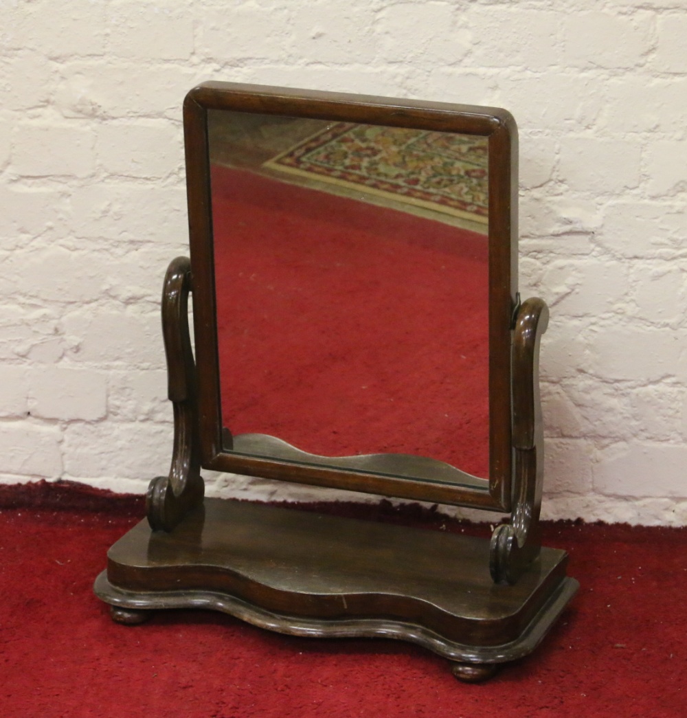 A Victorian mahogany toilet mirror on stand.