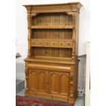 A large carved pine kitchen dresser set with six spice drawers over cupboard base.