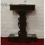 A Victorian carved mahogany stickstand.