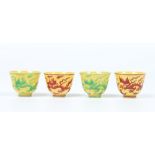 Two pairs of Chinese small thinly potted teabowls. Yellow ground and enamelled with dragons in red