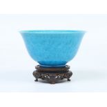 A Chinese song style turquoise glazed bowl on hardwood stand. With incised decoration depicting