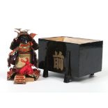 A Japanese Meiji period miniature suit of armour on stand in lacquered box used as a boys day gift,