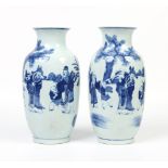 A pair of Chinese high shouldered mantel vases after Qianlong originals. Painted in underglaze