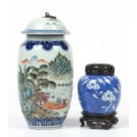 A Chinese famille vert vase and cover decorated with a landscape and a poem inscription, four