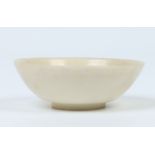 A turned hardstone bowl of mottled pale jade colour, 13.25cm diameter. Condition Report. To be