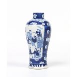 A nineteenth century Chinese baluster vase. Painted in underglaze blue with panels of figures over a