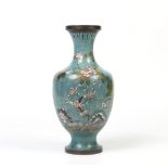 A twentieth century Chinese baluster cloisonne vase. Blue ground and decorated with peonies. Made in