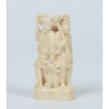 A Japanese carved ivory figure group of three men stood back to back. Signed, 11.5cm. Condition