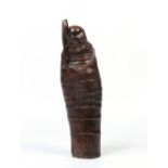 A Chinese carved bamboo figure formed as a bearded man clutching a staff and wrapped in a cloak,