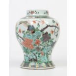 An antique Chinese baluster ginger jar base. Decorated in the famille vert palette with a bird stood