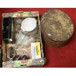 A box of miscellaneous ceramics and glasswares along with a tin hat box.