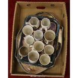 A box of commemorative/coronation mugs and a selection of silver plated serving trays.