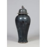 A large 20th century Chinese baluster floor vase and cover decorated in a midnight blue glaze the