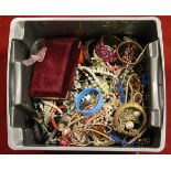 A large box of assorted costume jewellery to include beads, bangles etc.