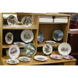 A collection of seventeen cabinet plates including part sets and Royal Worcester example many with