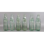 A collection of six glass codd bottles.