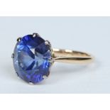 An 18 carat gold ring, claw set with a large brilliant cut sapphire approx 6 ct, ring size M.