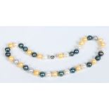 A pearl necklace with 14 carat gold spherical clasp. In tones of blue, white and yellow. 47cm,