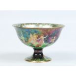 A Wedgwood fairyland lustre small pedestal bowl by Daisey Makeig-Jones. Decorated with a starlit