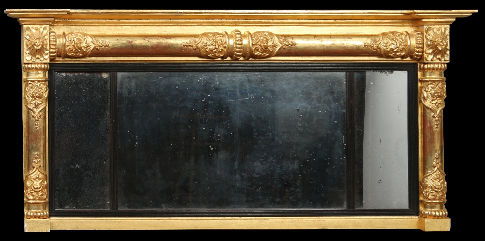 A Regency gilt framed three glass pier mirror with ebonized mouldings, 51cm x 115cm. Condition