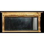 A Regency gilt framed three glass pier mirror with ebonized mouldings, 51cm x 115cm. Condition