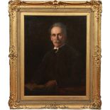 A large Edwardian gilt framed oil on canvas. Half length portrait of a seated gentleman. Label verso