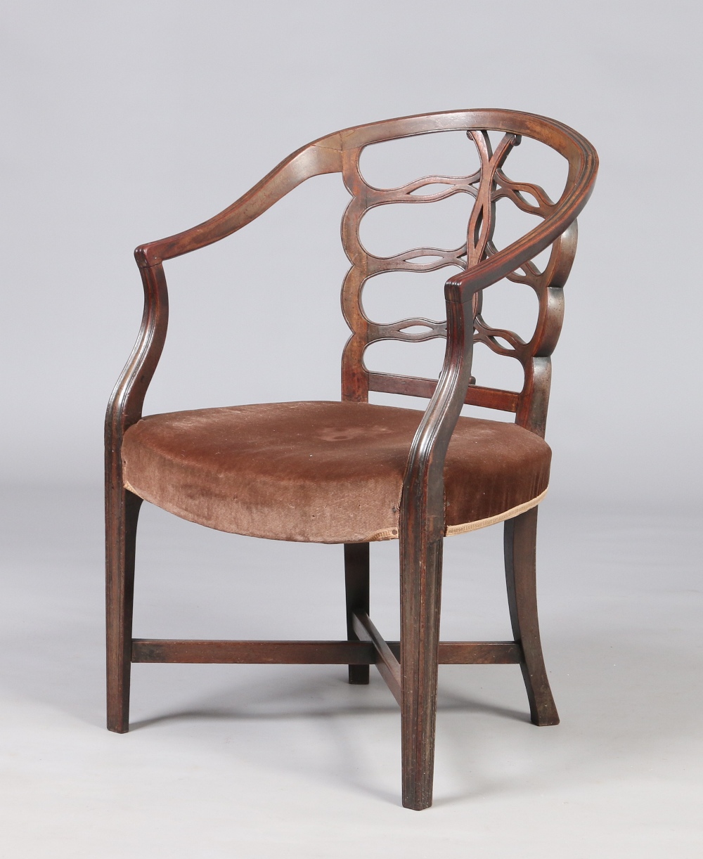 A Georgian mahogany carver armchair. With openwork backrest and reeded mouldings.  Condition Report.