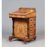 A Victorian bleached and figured walnut Davenport writing desk having maple lined interior. With