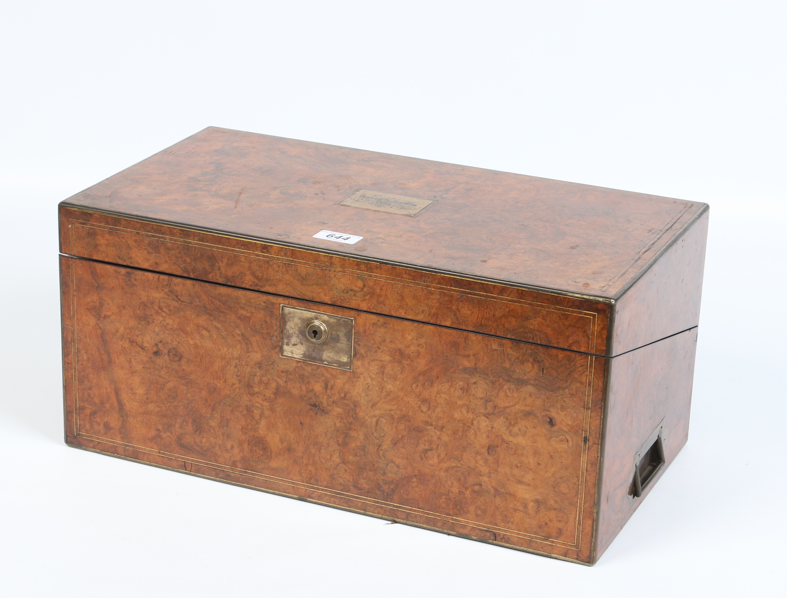 A Victorian burr walnut fitted writing slope. With brass mounts and inlay and engraved plaque,