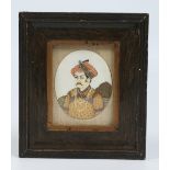 A framed Indian ivory portrait miniature of a Mogul prince. Condition Report. To be used as a