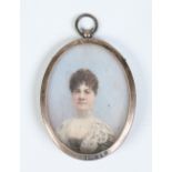 A Victorian oval ivory portrait miniature of a lady in a silver frame. Assayed Birmingham 1898, 7.
