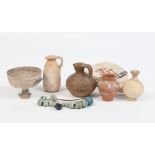 A collection of Antiquities. Mainly small pottery vessels. Also including a piece of jewellery and a