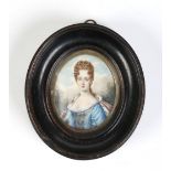 An oval ivory portrait miniature of a lady in carved frame.  Condition Report. To be used as a guide