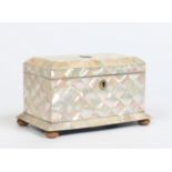 A Victorian bow front tea caddy with mother of pearl parquetry inlay and raised on turned ivory