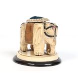 A Japanese Meiji period shibayama ivory elephant converted to a pin cushion, 16cm wide. Condition