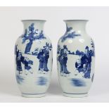 A large pair of Chinese baluster mantel vases. Painted in underglaze blue with landscape scenes
