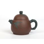 An early twentieth century Chinese Yixing teapot and cover with faux bamboo handle and spout.