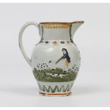 An early nineteenth century prattware jug. With applied mouldings depicting fox hunting scenes and