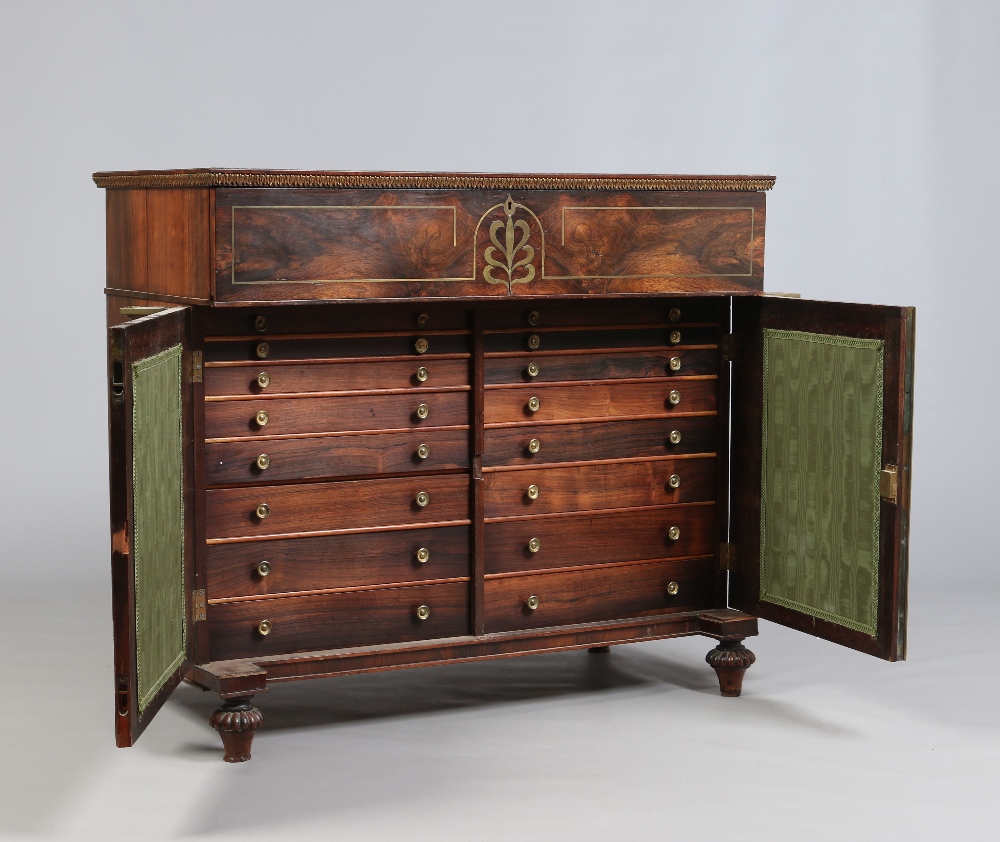A Regency rosewood secretaire chest. With brass inlay and raised over a cupboard base with grill - Image 2 of 3