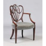 A nineteenth century mahogany Hepplewhite style carver armchair. With an openwork backrest with