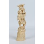 A Japanese carved ivory okimono. Formed as a warrior battling with a pair of Oni demons and with a