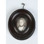 A small nineteenth century ivory portrait miniature of an older woman in carved wooden frame.